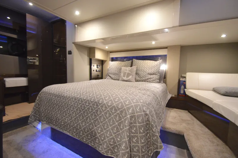 Play Craft Yacht Photos Pics Luxurious bedroom interior of 2018 Carver C52 Flybridge yacht with elegant bedding and ambient lighting.