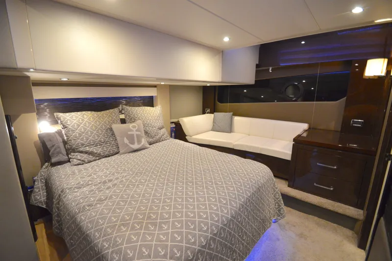 Play Craft Yacht Photos Pics Luxurious bedroom interior of 2018 Carver C52 Flybridge yacht with elegant bedding and seating.