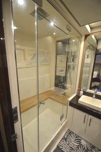 Play Craft Yacht Photos Pics Luxurious bathroom in 2018 Carver C52 Flybridge yacht with glass shower and modern fixtures.