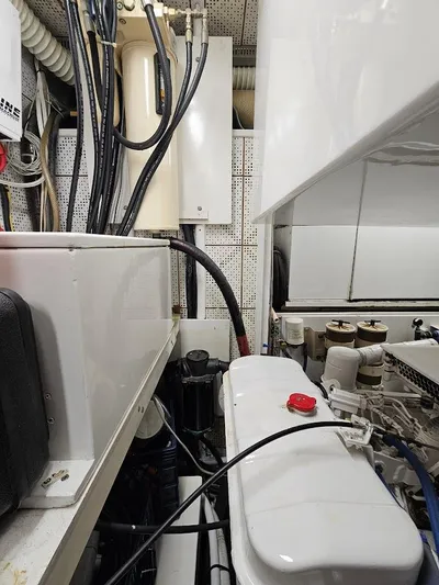  Yacht Photos Pics Engine room of 1987 DeFever 53 POC yacht with visible machinery and cables.