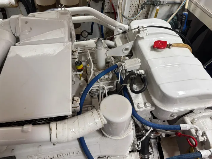  Yacht Photos Pics Engine room of a 1987 DeFever 53 POC yacht, showcasing mechanical components.