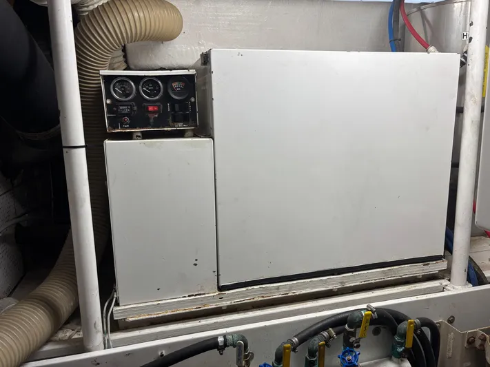  Yacht Photos Pics Engine room of 1987 DeFever 53 POC yacht with control panel and hoses.