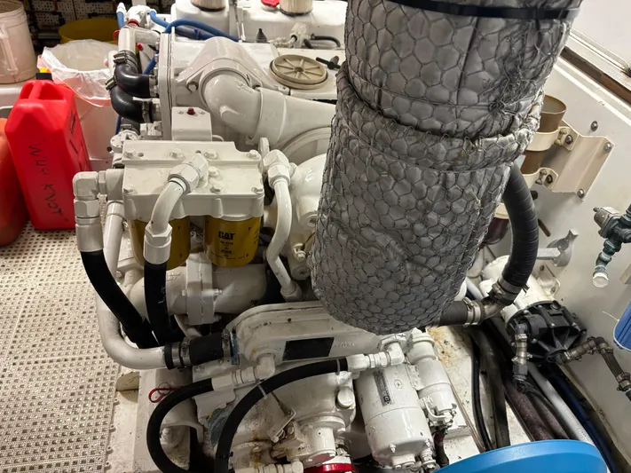  Yacht Photos Pics Engine room of 1987 DeFever 53 POC yacht, featuring mechanical components and hoses.