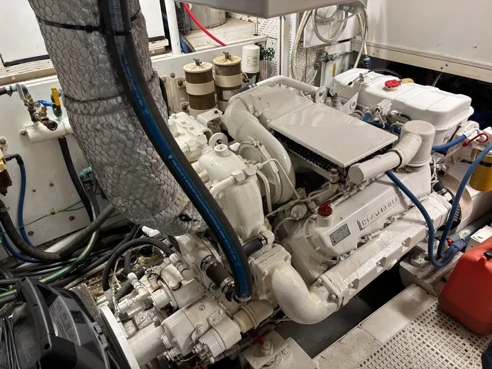  Yacht Photos Pics Engine room of 1987 DeFever 53 POC yacht, showcasing mechanical components and piping.