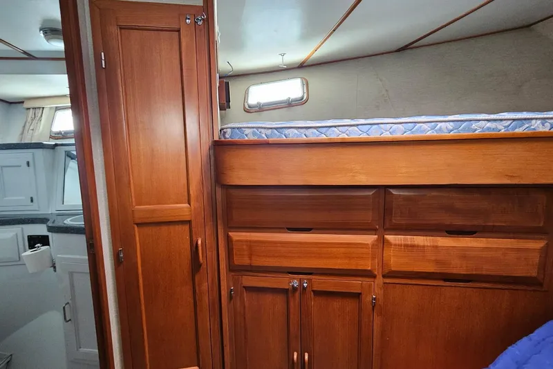  Yacht Photos Pics 1987 DeFever 53 POC yacht interior with wooden cabinetry and bunk bed.