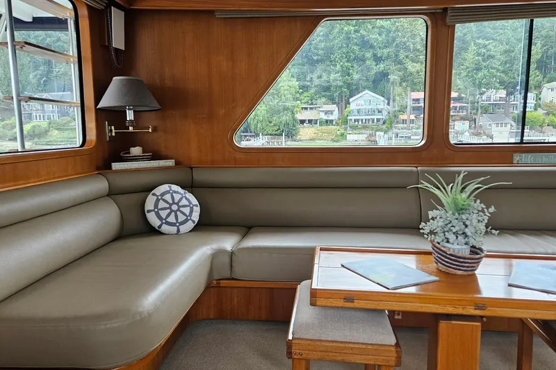  Yacht Photos Pics Cozy interior of 1987 DeFever 53 POC yacht with scenic window view.