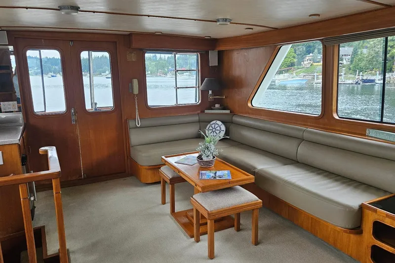  Yacht Photos Pics Interior of 1987 DeFever 53 POC yacht with spacious seating and scenic windows.