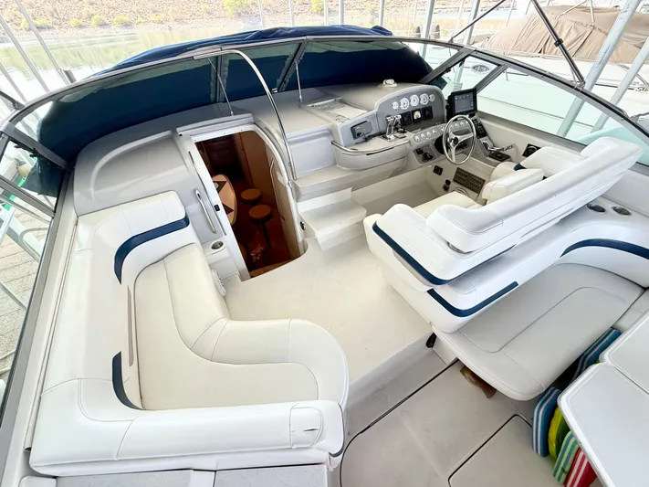 Formula 41pc Yacht Photos Pics 1999 Formula 41 PC yacht interior with white seating and control panel.
