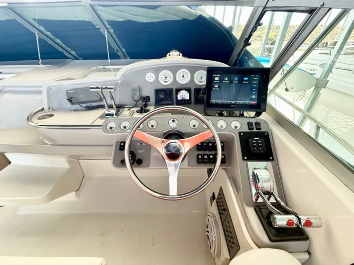Formula 41pc Yacht Photos Pics 1999 Formula 41 PC boat helm with modern controls and navigation display.