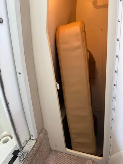 Formula 41pc Yacht Photos Pics 1999 Formula 41 PC interior storage with beige cushion.