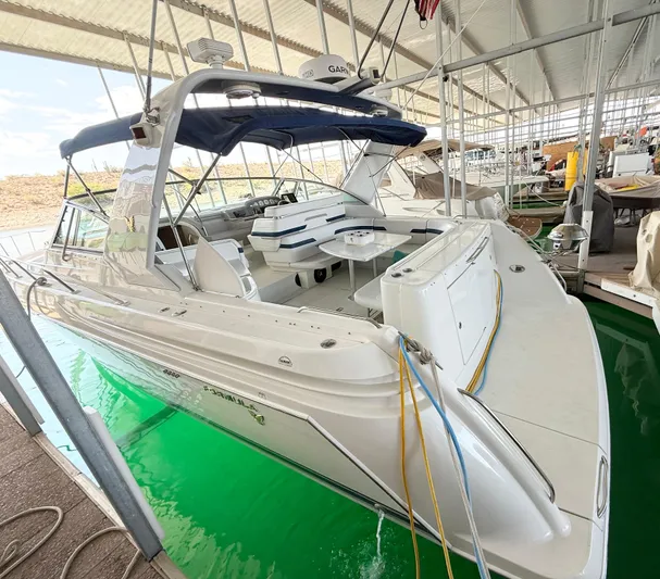 Formula 41pc Yacht Photos Pics 1999 Formula 41 PC yacht docked in a covered marina, featuring spacious seating and sleek design.