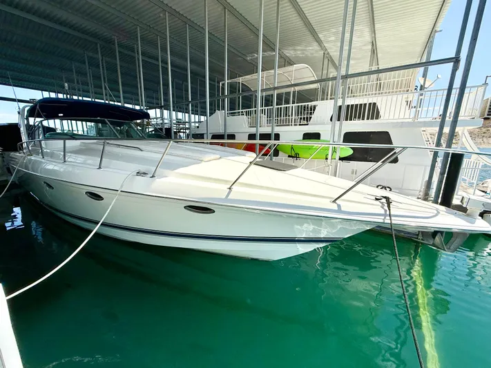 Formula 41pc Yacht Photos Pics 1999 Formula 41 PC yacht docked in marina under covered shelter.