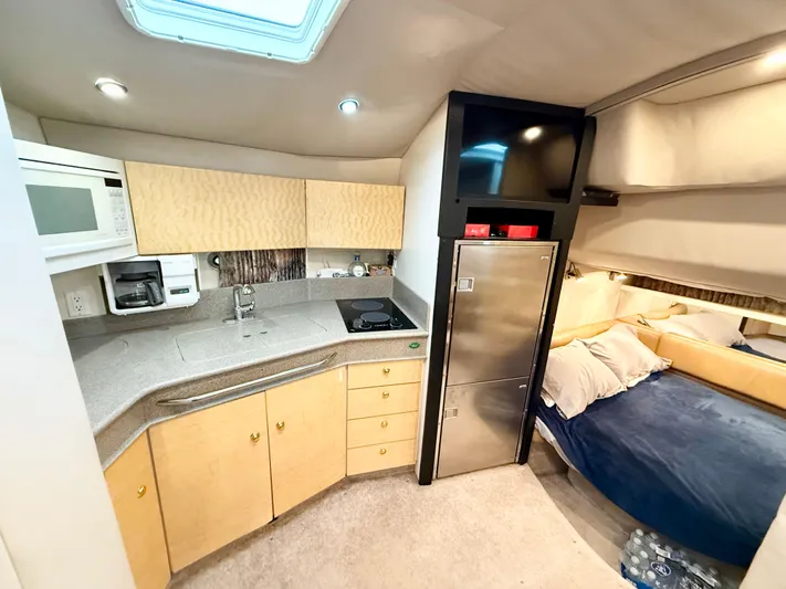 Formula 41pc Yacht Photos Pics 1999 Formula 41 PC yacht interior with kitchenette, bed, and modern amenities.