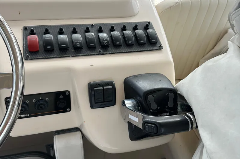 Triple Threat Yacht Photos Pics Control panel of a 2008 Grady-White Express 330 boat with Yamaha throttle.
