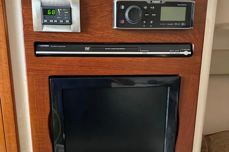 Triple Threat Yacht Photos Pics Control panel and entertainment system on 2008 Grady-White Express 330 boat.