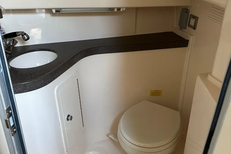 Triple Threat Yacht Photos Pics 2008 Grady-White Express 330 boat bathroom with sink and toilet.