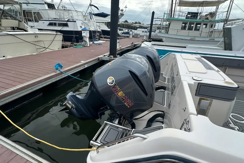 Triple Threat Yacht Photos Pics 2008 Grady-White Express 330 with Yamaha outboard engines docked at a marina.