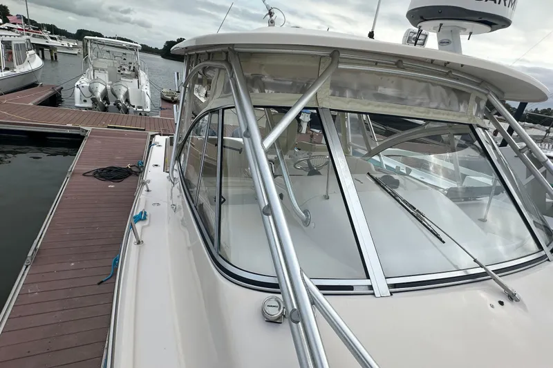 Triple Threat Yacht Photos Pics 2008 Grady-White Express 330 docked at marina, showcasing sleek design and sturdy build.