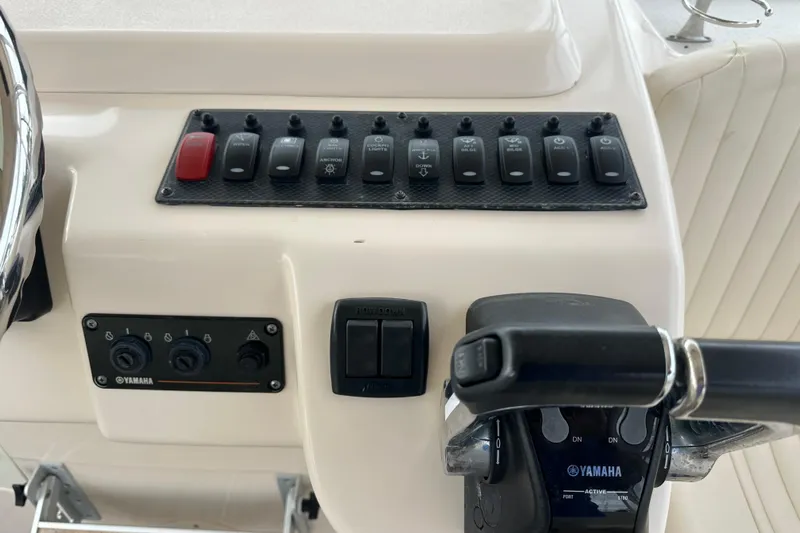Triple Threat Yacht Photos Pics Control panel of a 2008 Grady-White Express 330 boat with Yamaha controls.