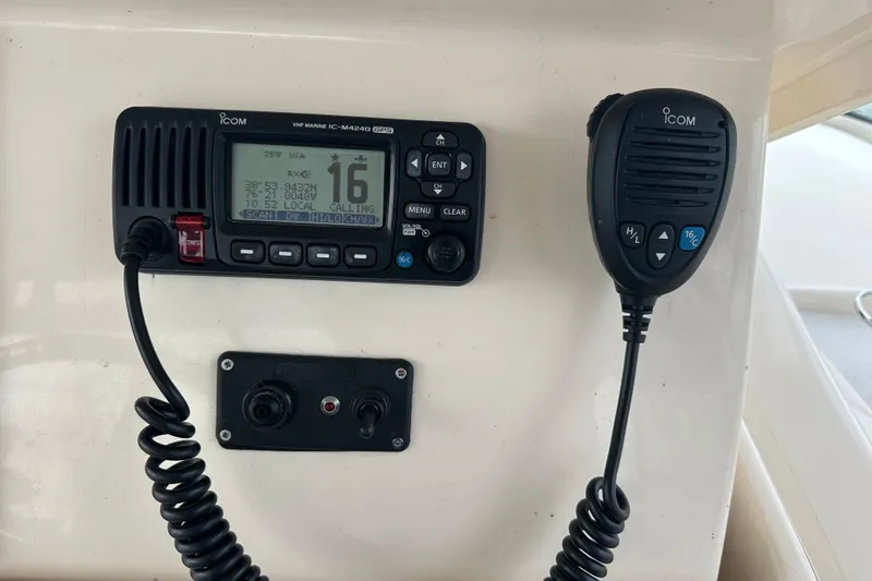 Triple Threat Yacht Photos Pics VHF marine radio on 2008 Grady-White Express 330 boat dashboard.