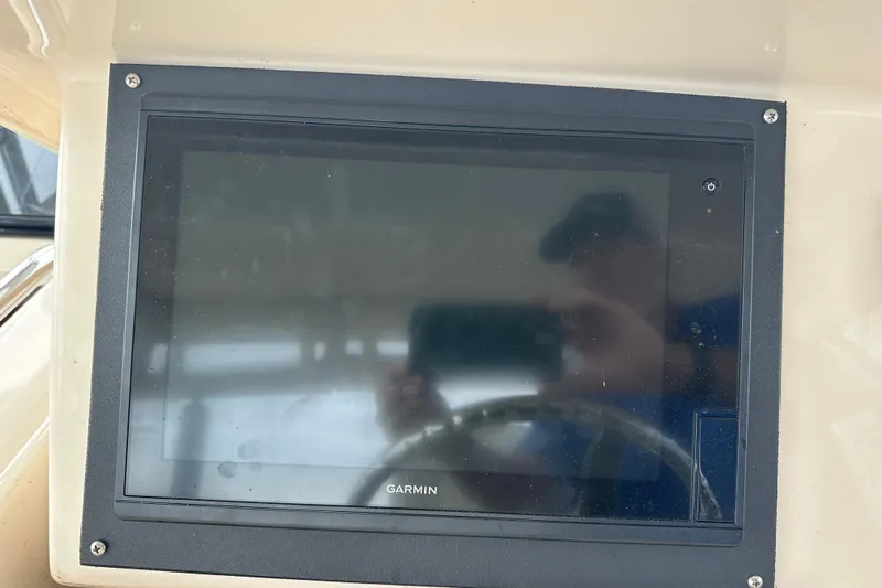 Triple Threat Yacht Photos Pics Garmin display on 2008 Grady-White Express 330 boat dashboard.