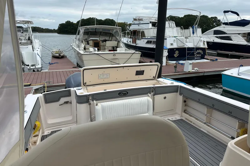 Triple Threat Yacht Photos Pics 2008 Grady-White Express 330 boat docked at marina with other vessels.