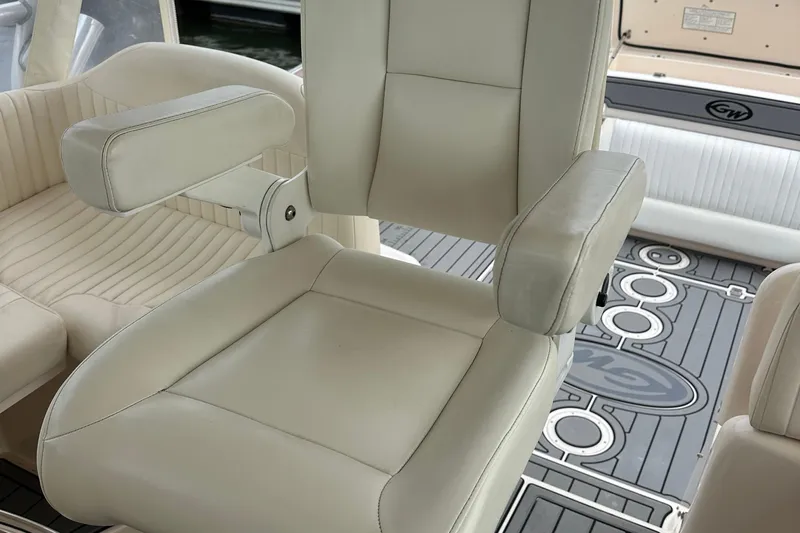 Triple Threat Yacht Photos Pics Luxury seating on 2008 Grady-White Express 330 boat, featuring plush white upholstery.