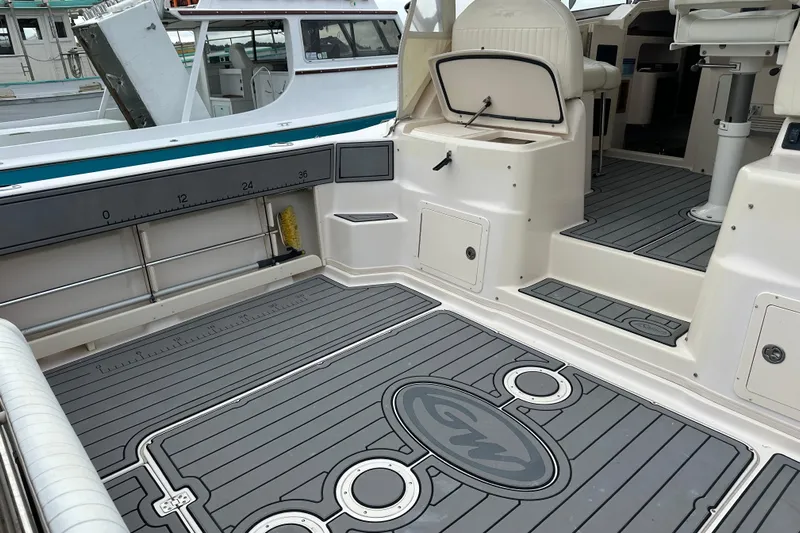 Triple Threat Yacht Photos Pics 2008 Grady-White Express 330 boat interior with spacious deck and seating area.