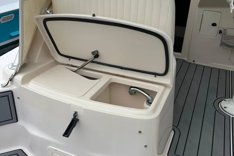 Triple Threat Yacht Photos Pics 2008 Grady-White Express 330 boat sink with open lid and faucet.