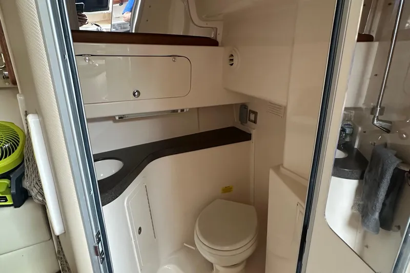Triple Threat Yacht Photos Pics 2008 Grady-White Express 330 boat bathroom with compact design and modern amenities.