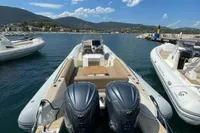 2023 Capelli Tempest 1000 Open boat docked in a scenic marina.