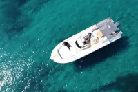 Aerial view of 2023 Capelli Tempest 1000 Open boat on clear blue water.