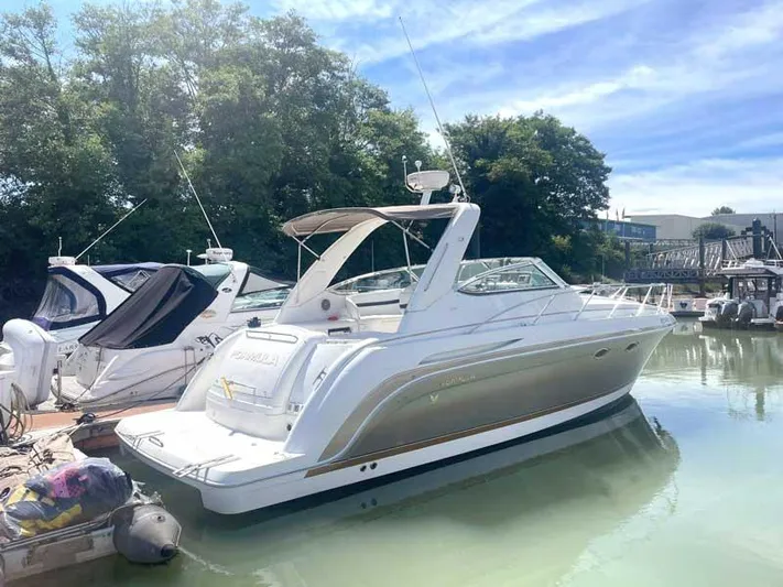  Yacht Photos Pics 2003 Formula 37 PC yacht docked in a serene marina setting.