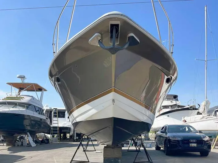  Yacht Photos Pics 2003 Formula 37 PC yacht on dry dock with nearby vehicles and boats.
