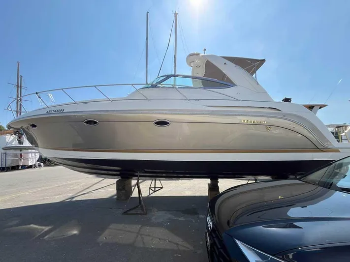  Yacht Photos Pics 2003 Formula 37 PC yacht on dry dock under clear blue sky.