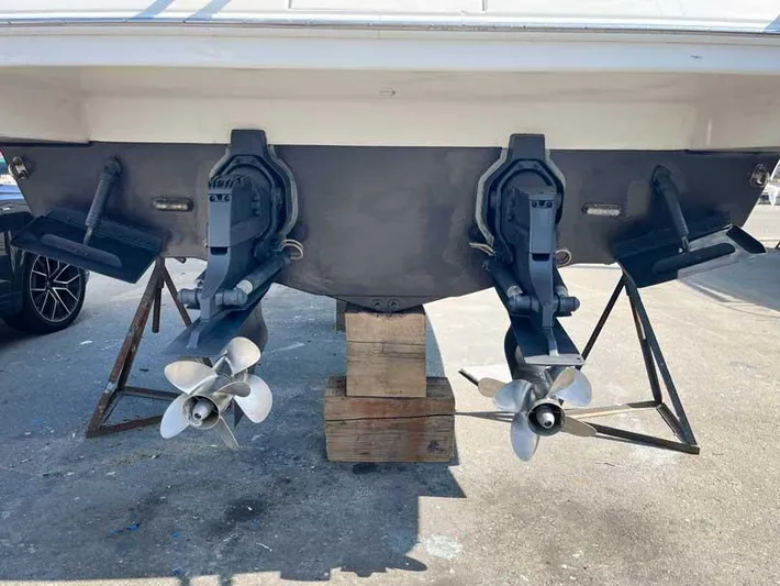  Yacht Photos Pics 2003 Formula 37 PC boat stern with dual propellers on stands.