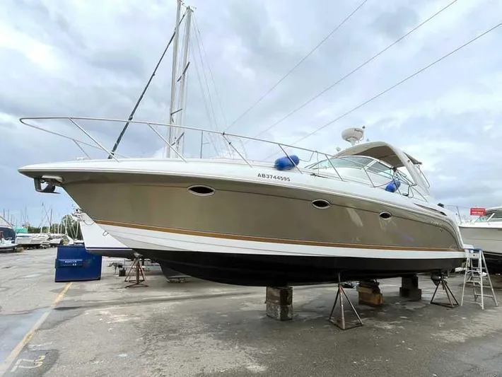  Yacht Photos Pics 2003 Formula 37 PC yacht on dry dock, overcast sky background.