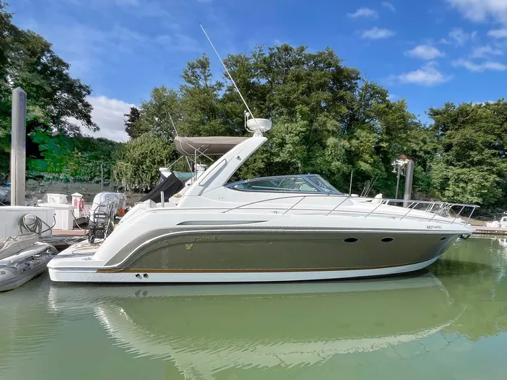 Yacht Photos Pics 2003 Formula 37 PC yacht docked in a serene marina setting.