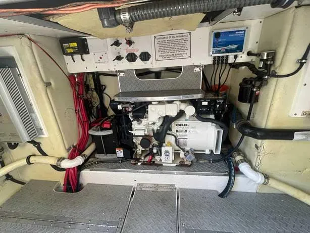  Yacht Photos Pics Engine room of a 2003 Formula 37 PC boat with Kohler generator and wiring.