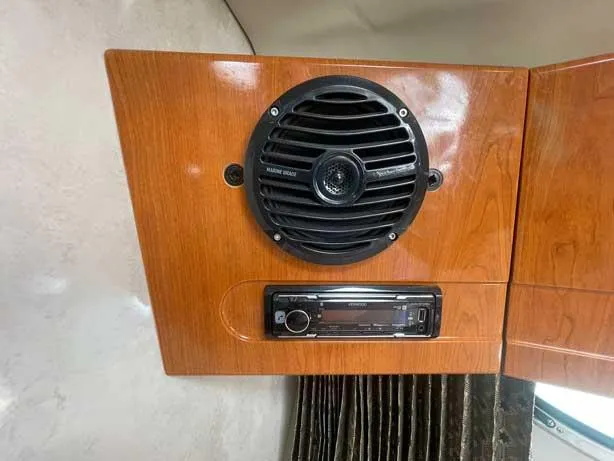  Yacht Photos Pics Wooden panel with a marine audio speaker and stereo system in a 2003 Formula 37 PC.