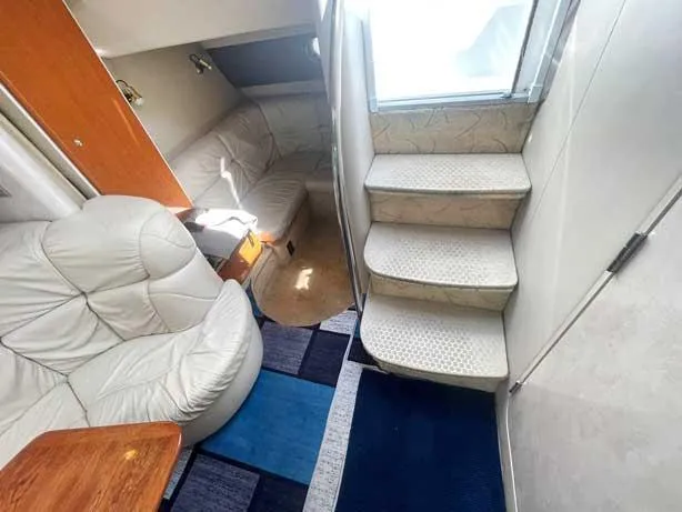  Yacht Photos Pics Interior of 2003 Formula 37 PC yacht with plush seating and carpeted stairs.