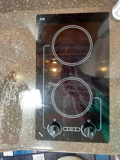  Yacht Photos Pics Ceramic cooktop with two burners on a speckled countertop, Formula 37 PC, 2003 model.