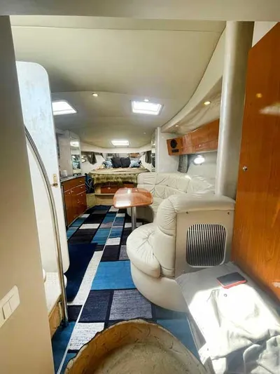  Yacht Photos Pics Interior of a 2003 Formula 37 PC yacht with modern furnishings and vibrant carpet.