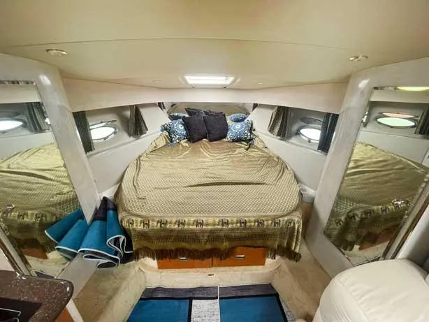  Yacht Photos Pics Luxurious cabin interior of 2003 Formula 37 PC yacht with cozy bed and elegant decor.