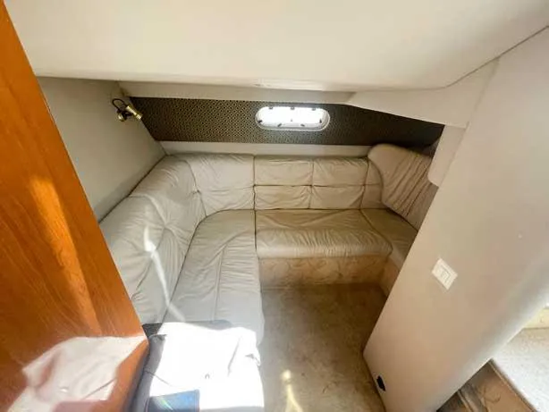  Yacht Photos Pics 2003 Formula 37 PC yacht interior with beige leather seating and small window.