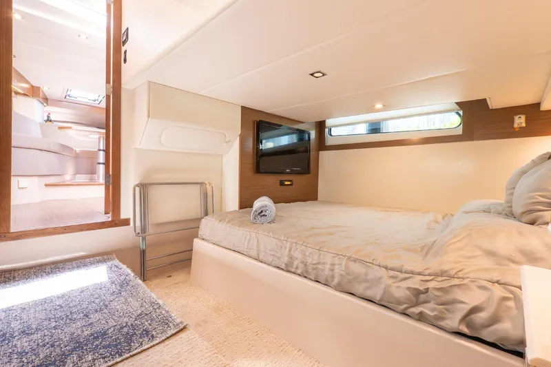  Yacht Photos Pics Luxurious cabin interior of 2016 Cruisers Yachts 390 Express Coupe with cozy bed and modern decor.