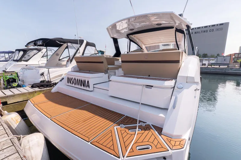  Yacht Photos Pics 2016 Cruisers Yachts 390 Express Coupe docked, featuring spacious deck and seating.