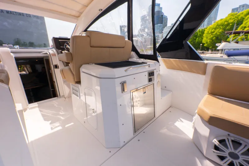  Yacht Photos Pics 2016 Cruisers Yachts 390 Express Coupe interior with seating and control panel.