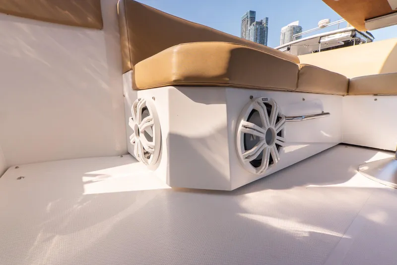  Yacht Photos Pics 2016 Cruisers Yachts 390 Express Coupe interior with beige seating and built-in speakers.