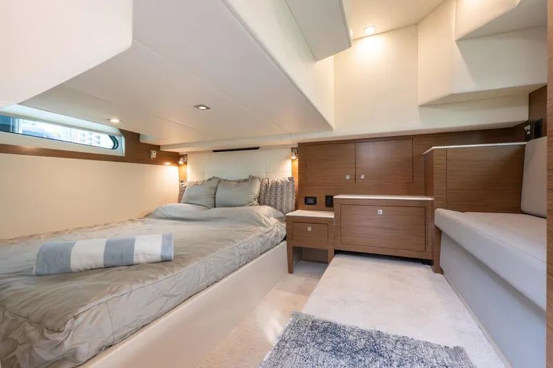  Yacht Photos Pics Luxurious cabin interior of 2016 Cruisers Yachts 390 Express Coupe with modern furnishings.